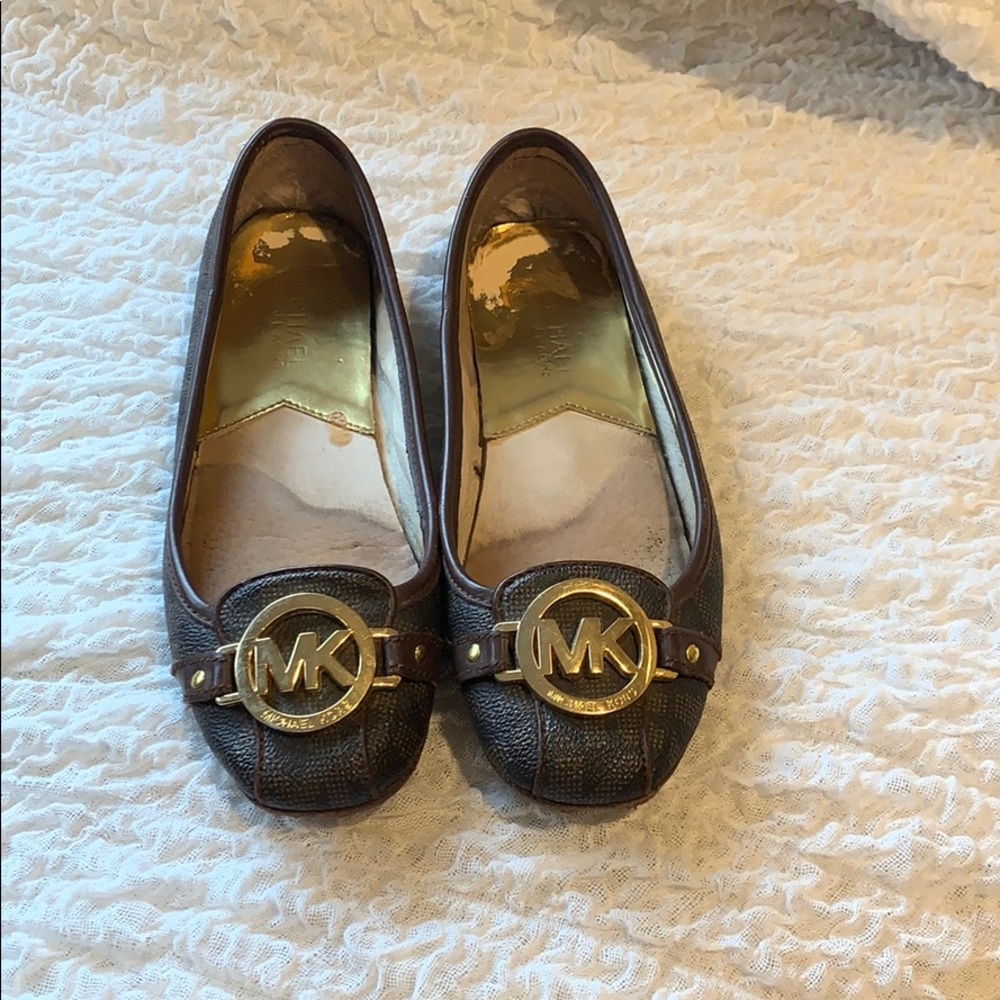 Michael Kors brown leather flats.
